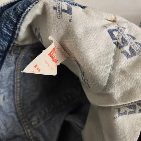 Vintage Levi's 557 Cowboy Distressed Jeans